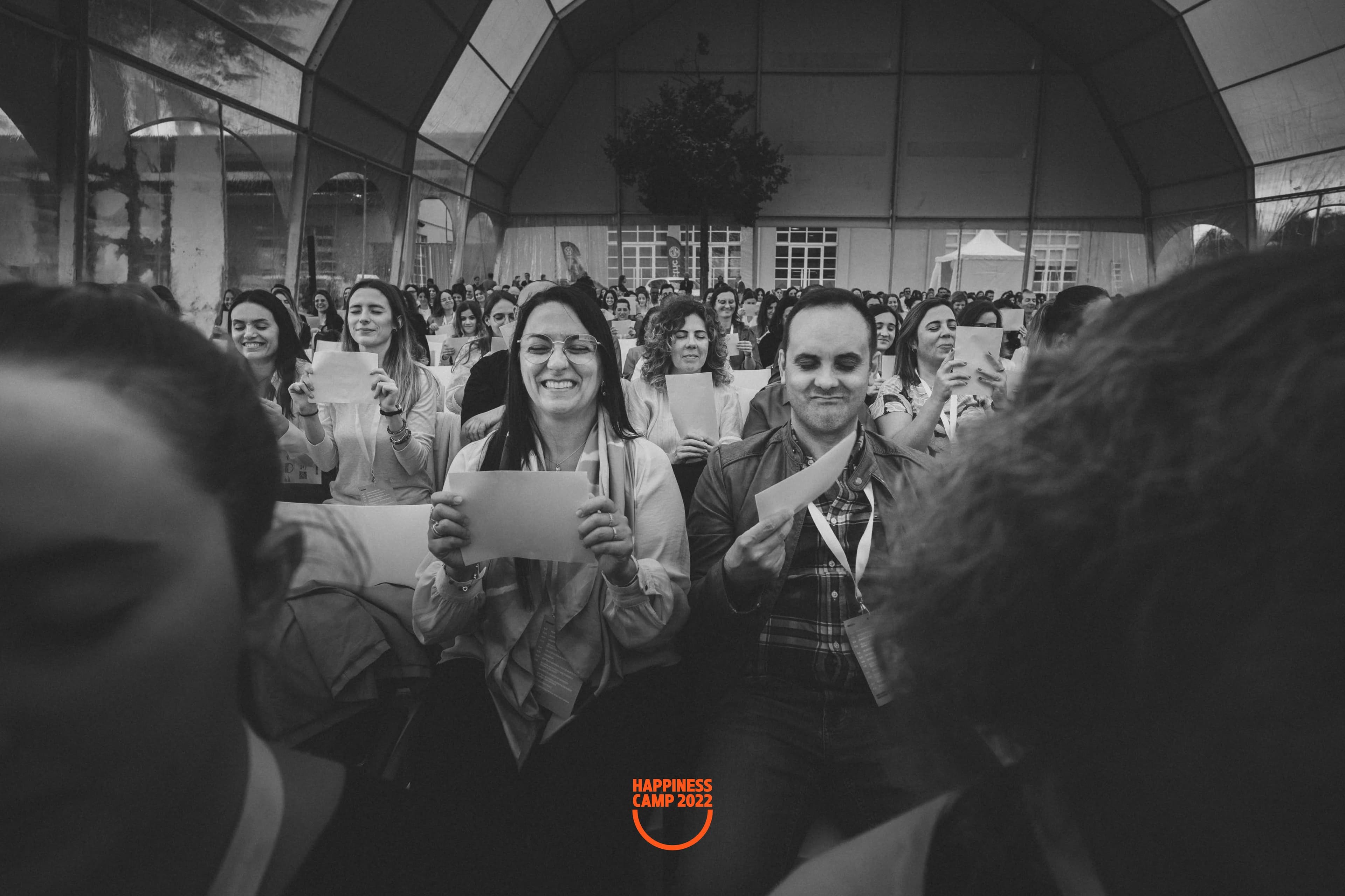Audience laughing during a Happiness Camp keynote led by Dr. Kefferputz