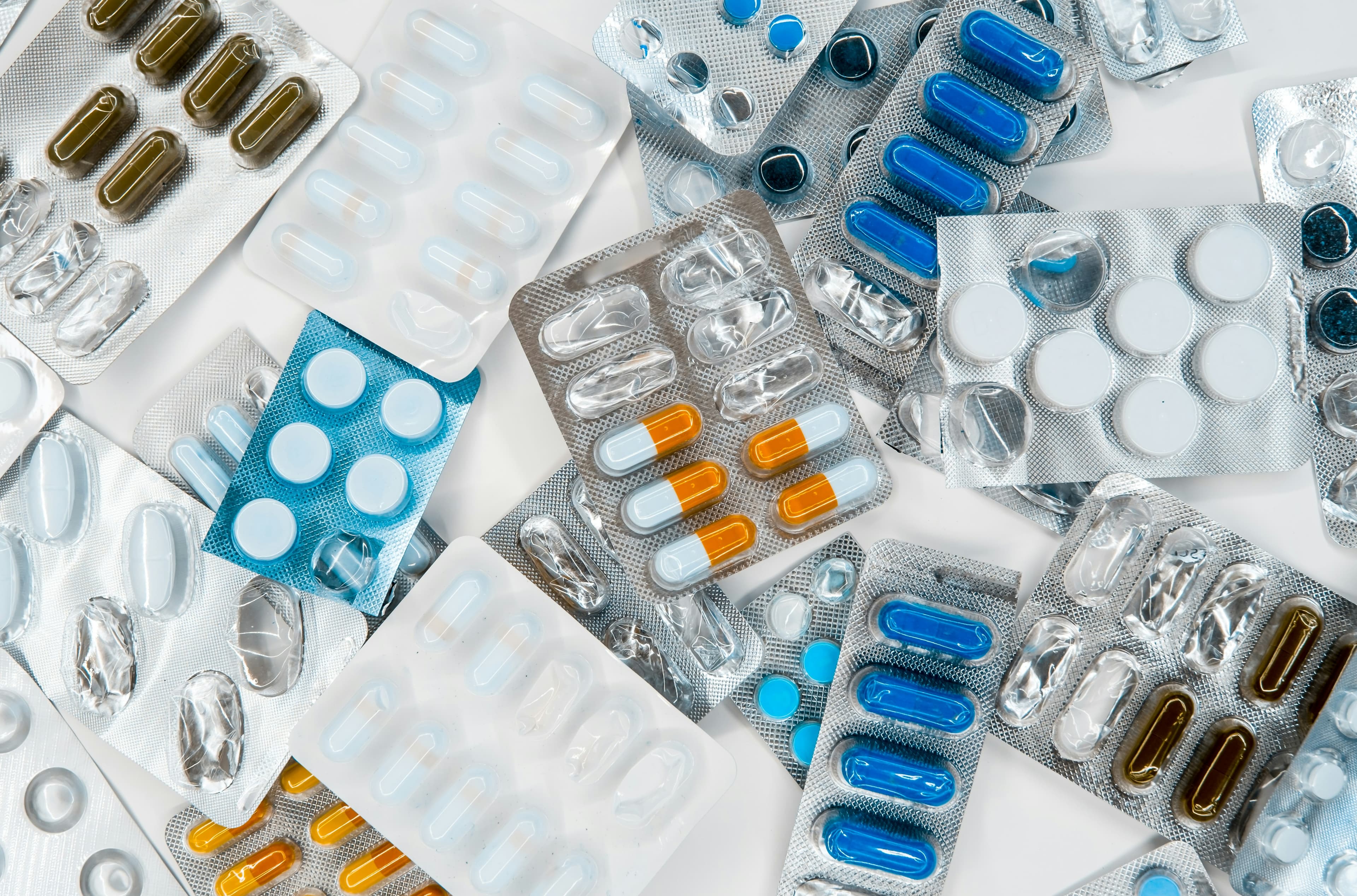 Blister packs of various medications spread out