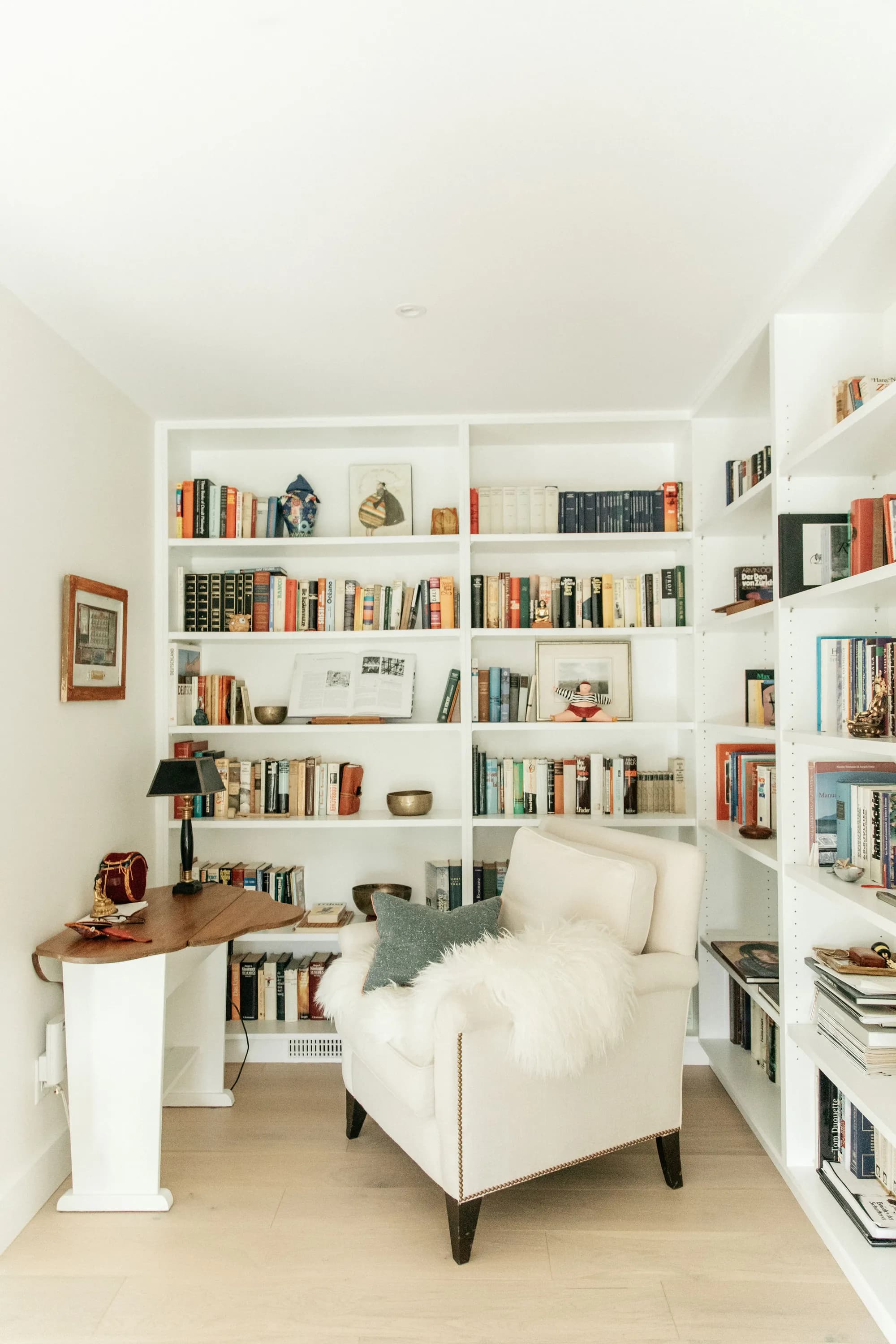 Cozy reading nook with bookshelves and armchair