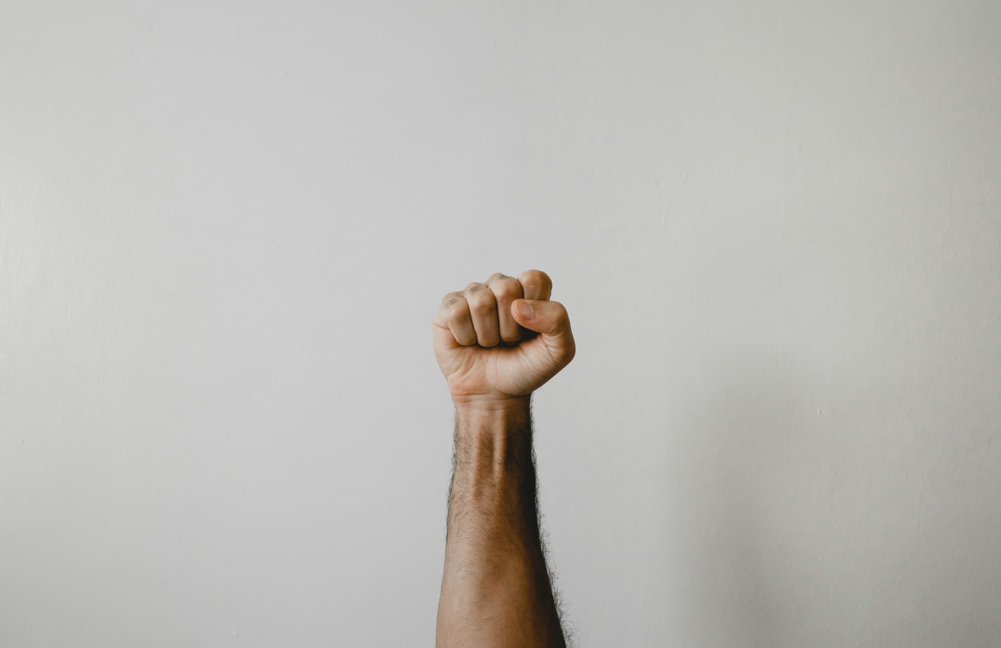 Man raising a fist in strength